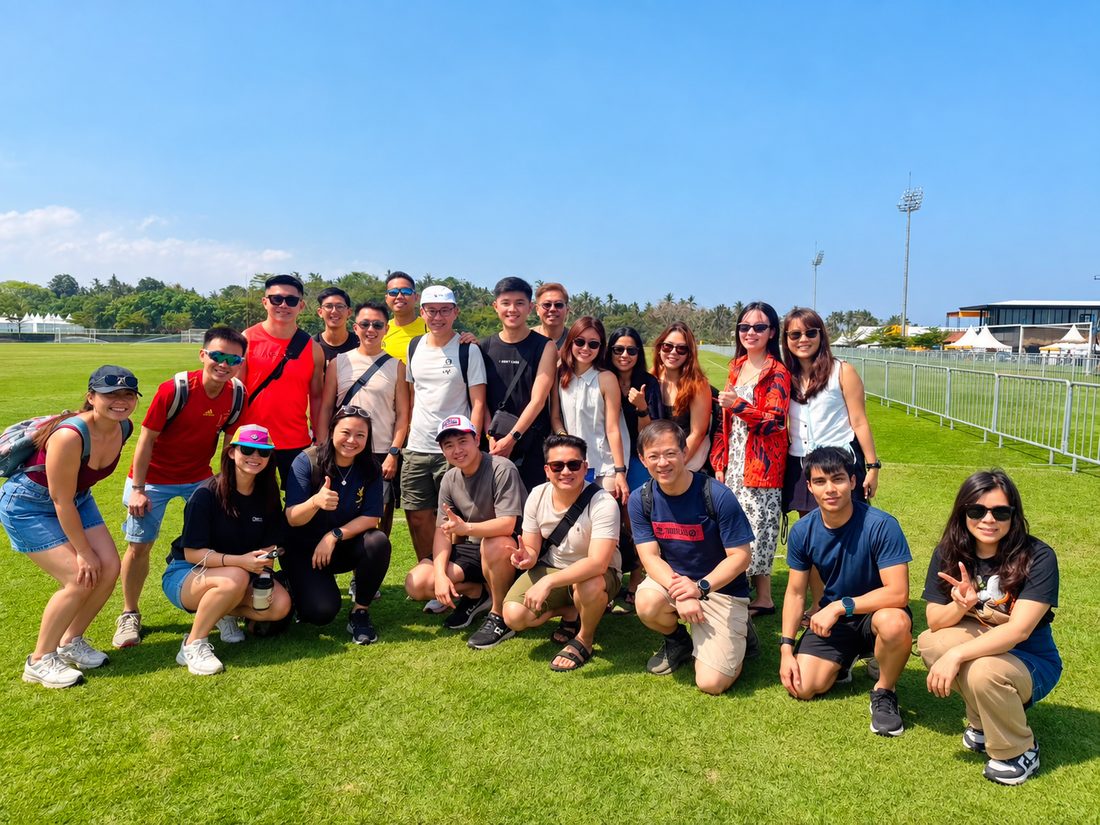The group together on a field in Bali