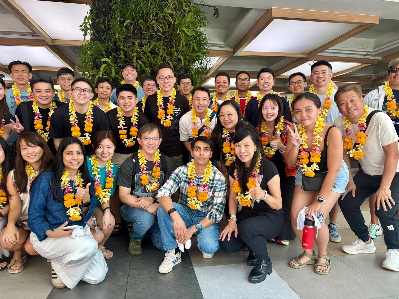 A private tour group given welcome garlands on arrival in Bali